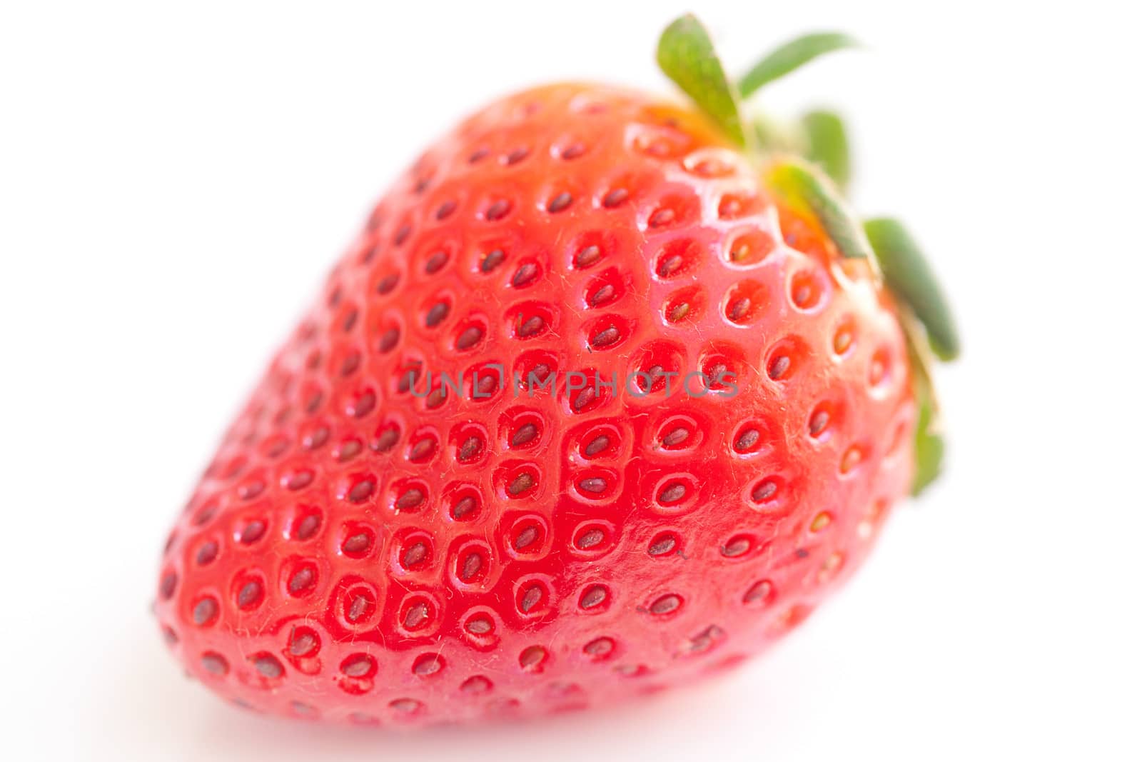 big red strawberry isolated on white by jannyjus
