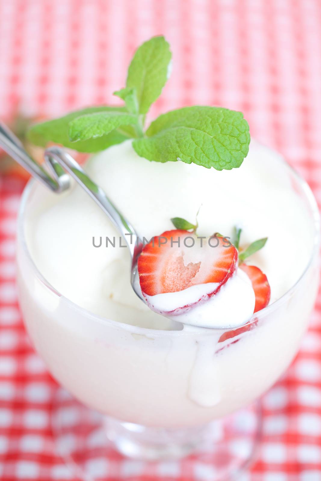 ice cream,strawberry with mint in a glass bowl on plaid fabric by jannyjus