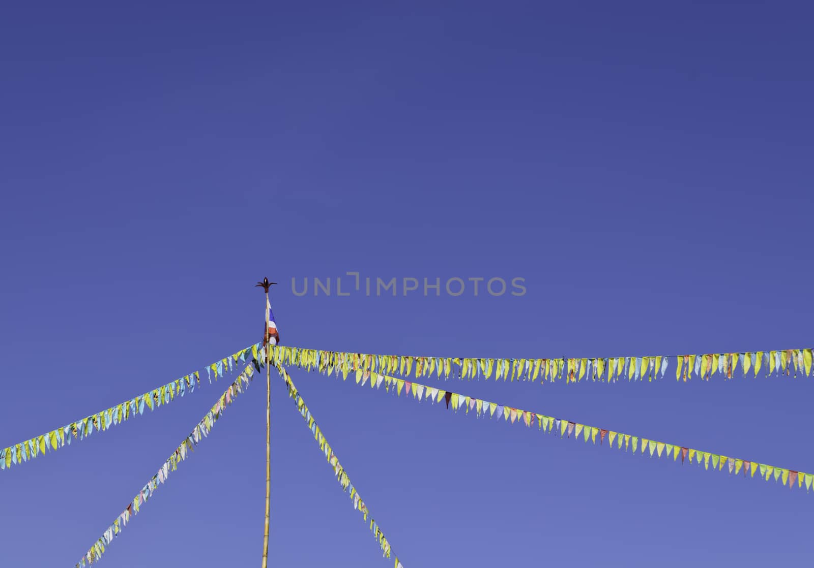 Colorful bunting flags against blue sky