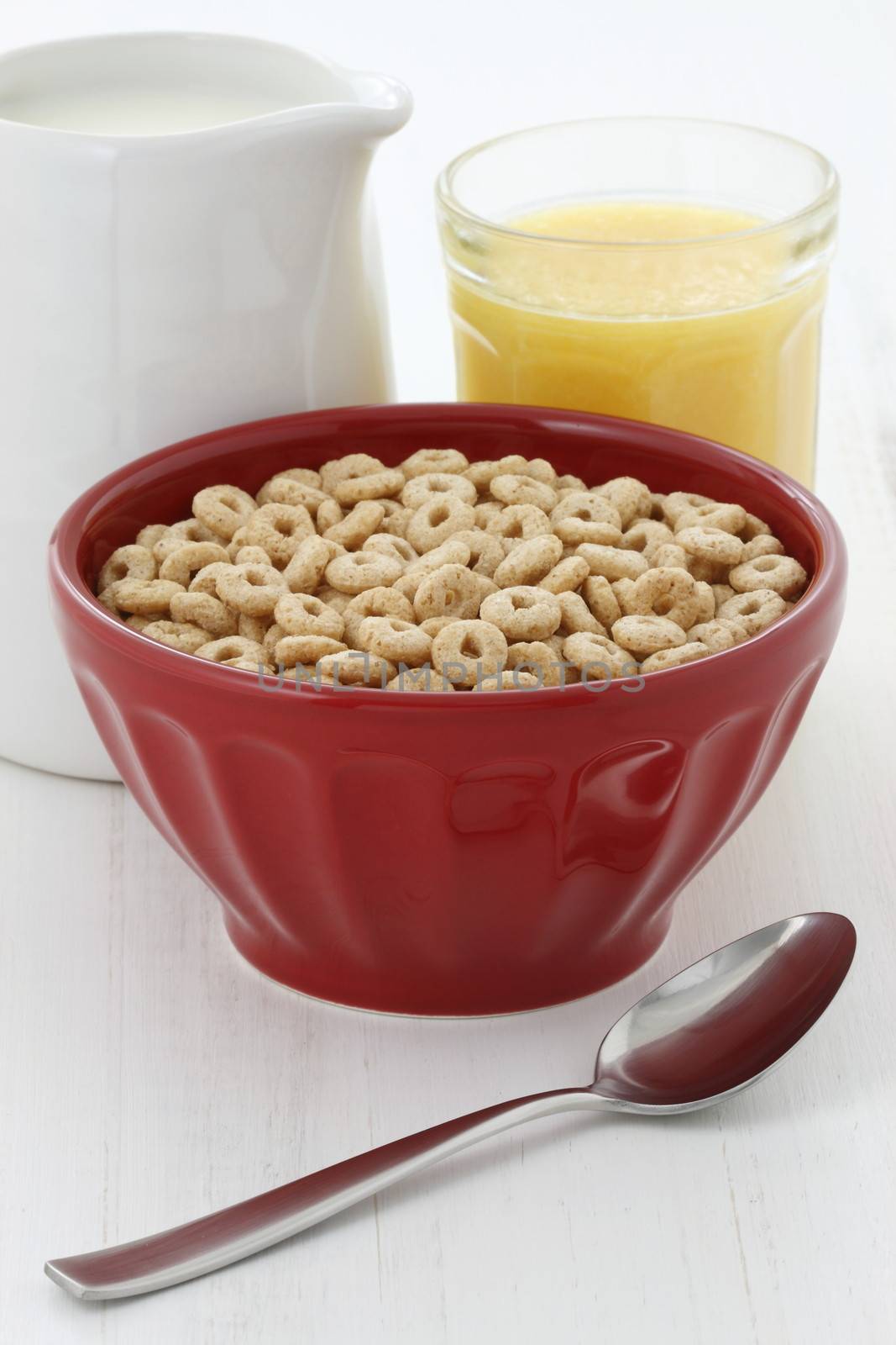 Delicious and nutritious lightly toasted honey, nuts and oats cereal with milk.