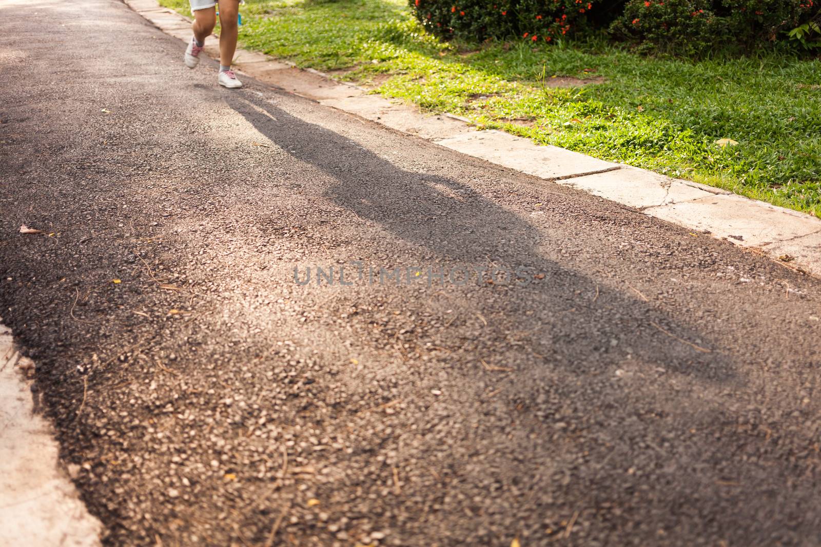woman running jogging on street by moggara12