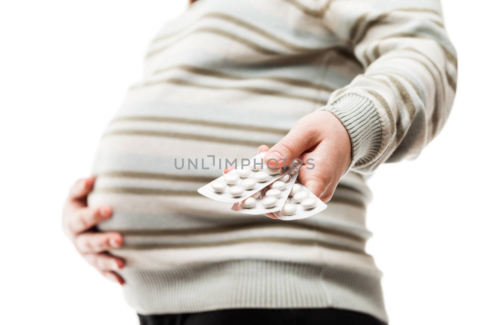 Pregnant woman hand holding medicine healthcare vitamin pills white isolated
