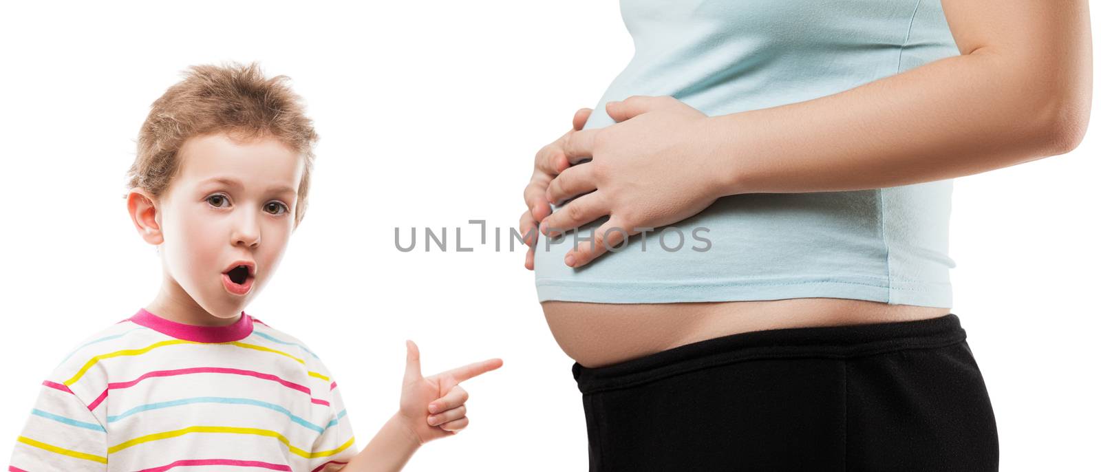 Child boy pointing his pregnant mother abdomen by ia_64