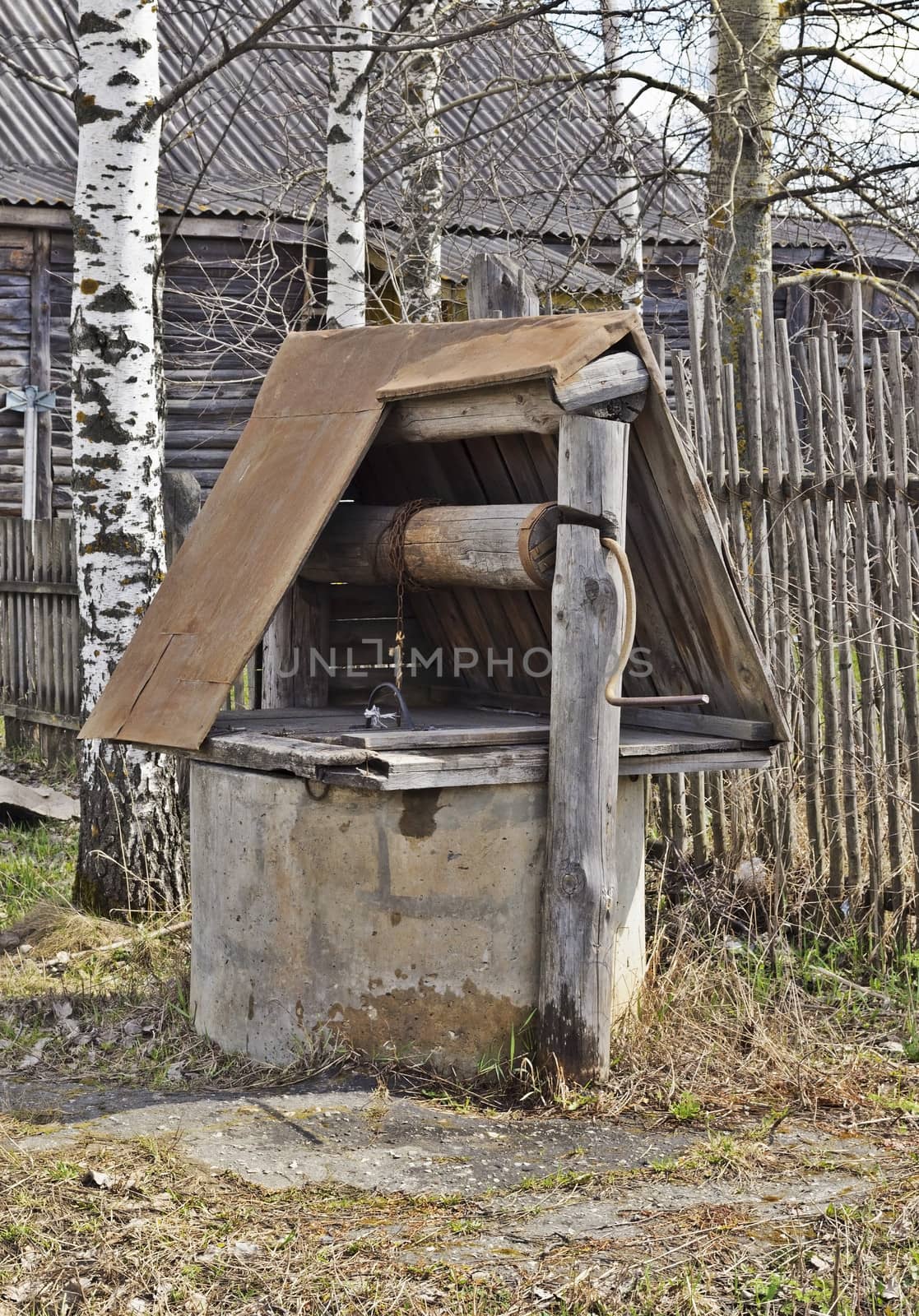 Old village water well near the house