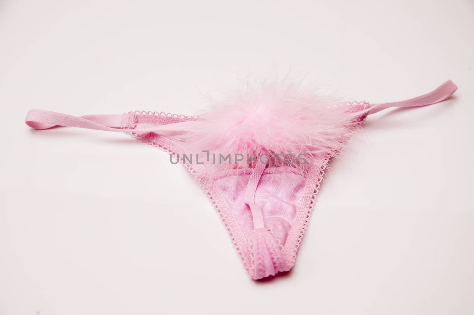 pink thong with a pompon behind