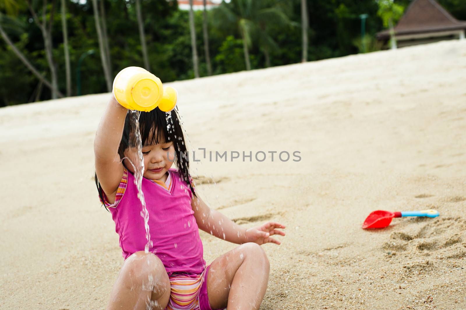 Young toddler at the beach having fun and is curios