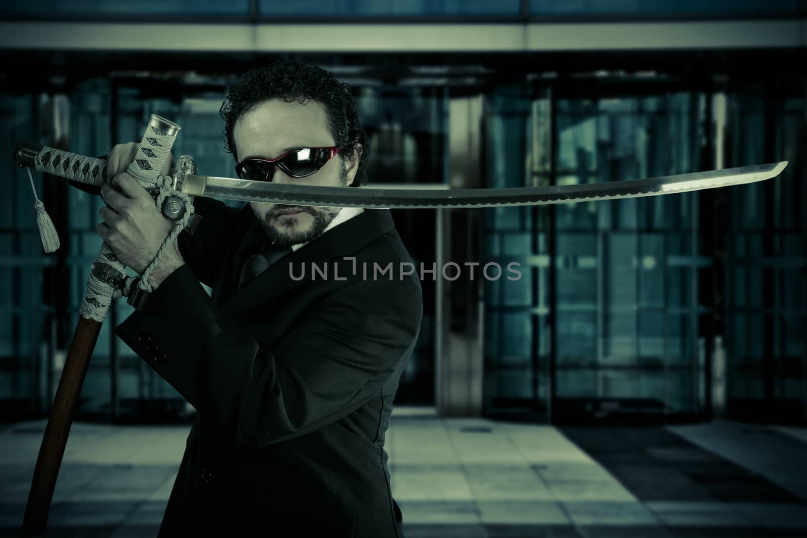 businessman with suit and Japanese sword, office building