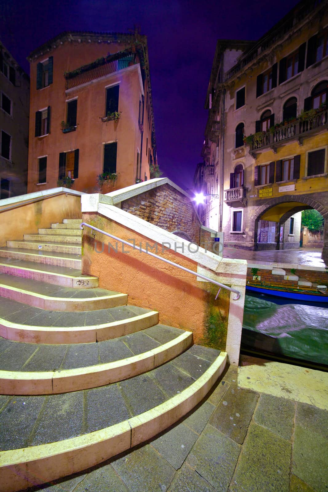 View of a street in venice in the night, Venice, Italy. Vertical view