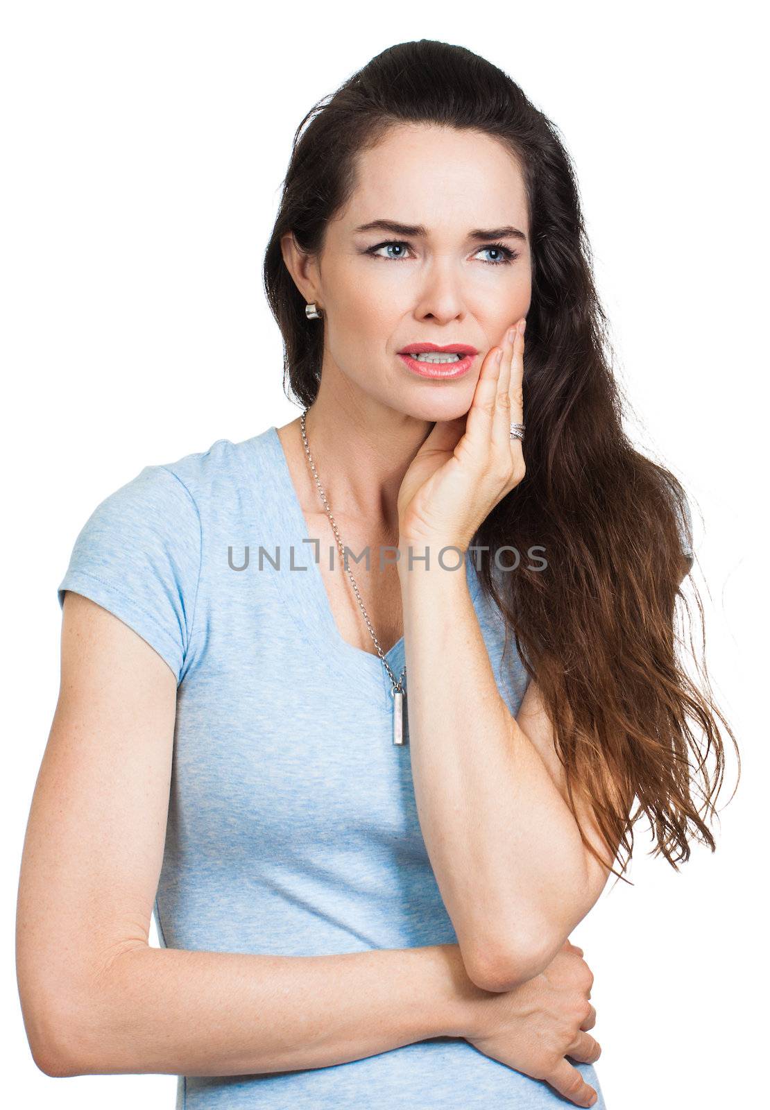 A young woman suffering from toothache. Isolated on white.