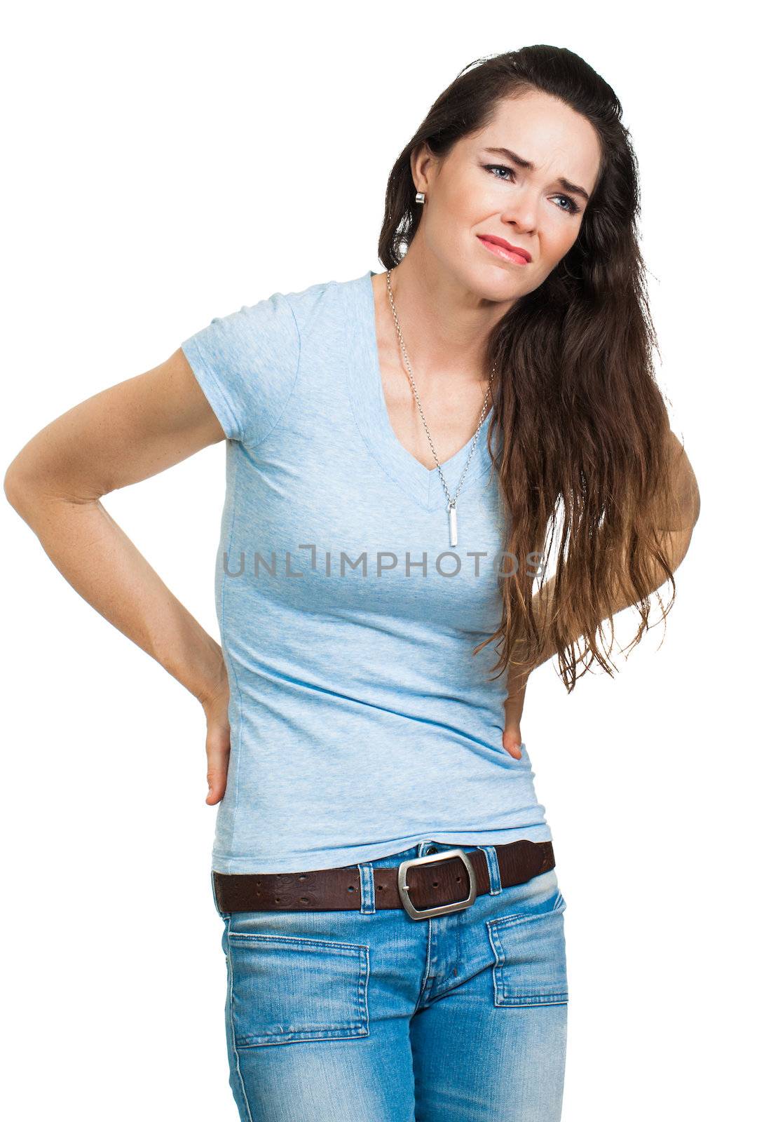 A woman suffering from lower back pain. Isolated on white.