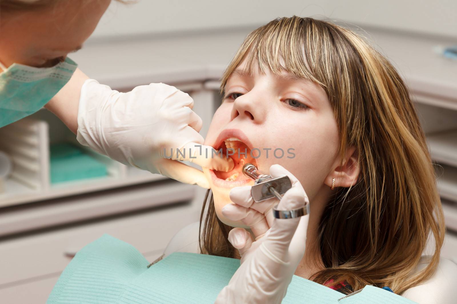 Dentist make anesthesia with a large syringe