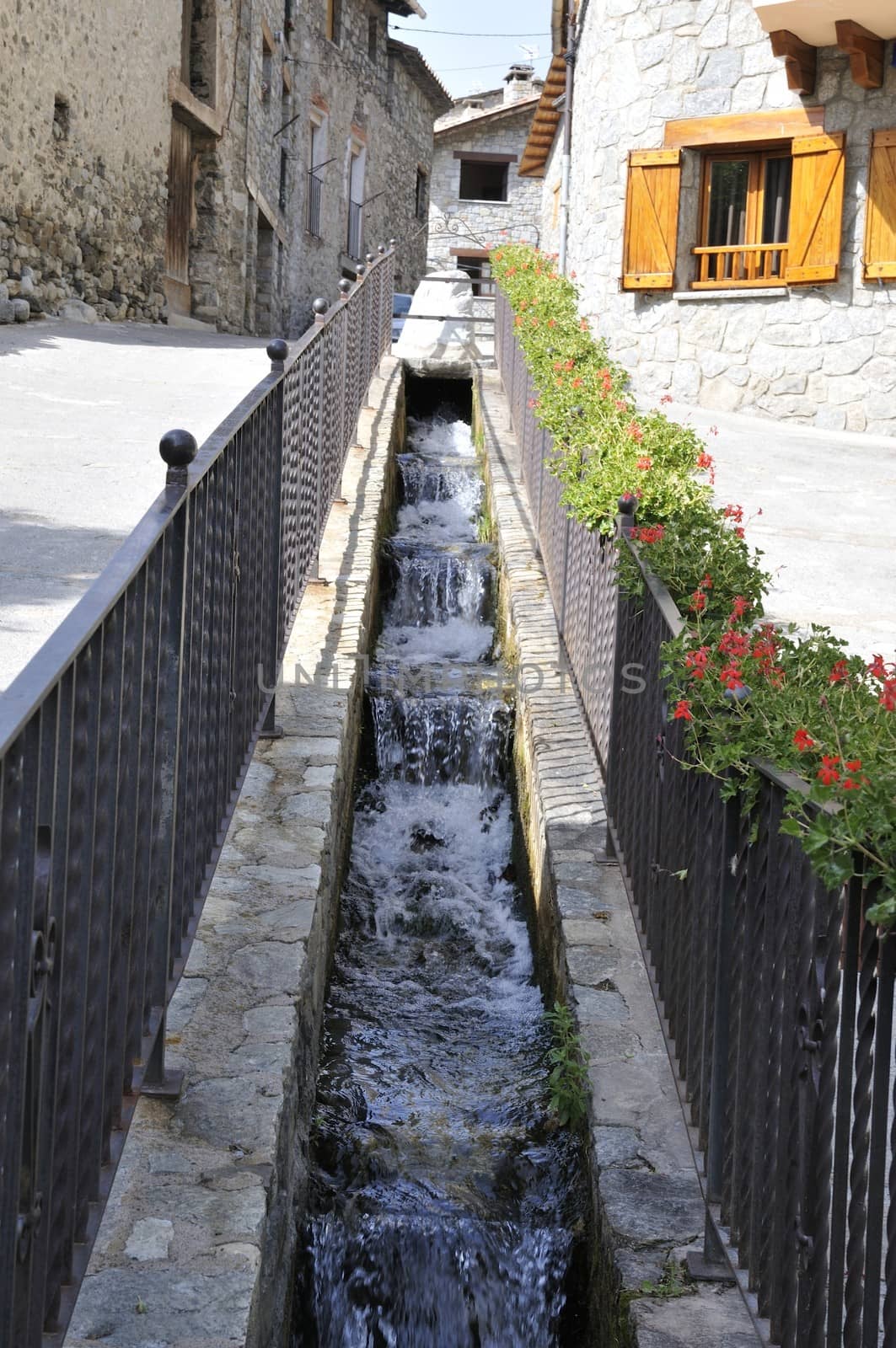 stream crossing houses to irrigate
