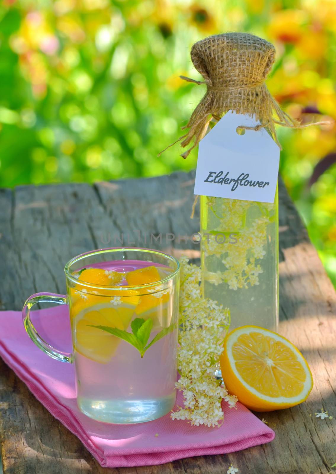 elderflower juice on wooden background