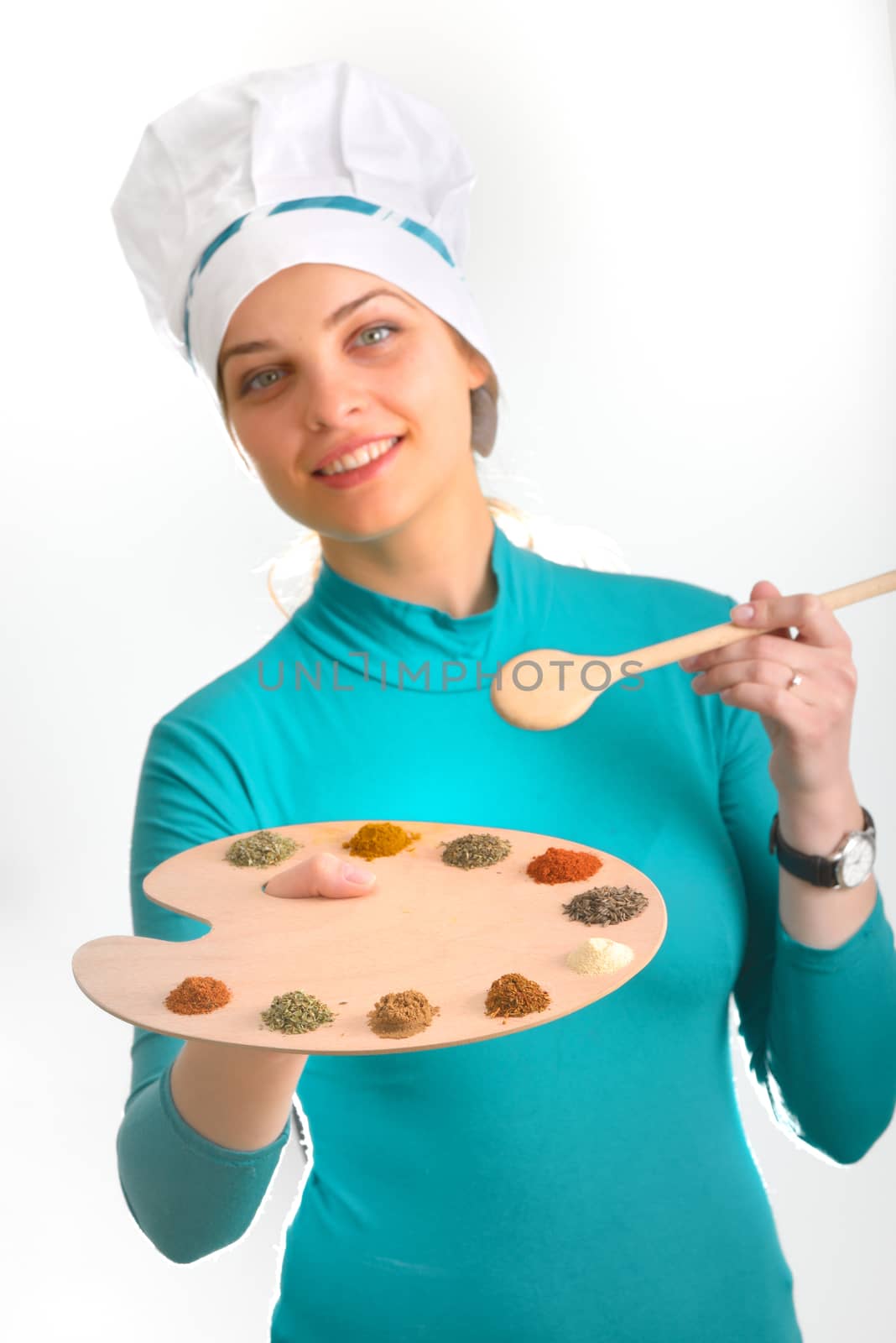 Spices and herbs on the palette and cook girl shoot in studio