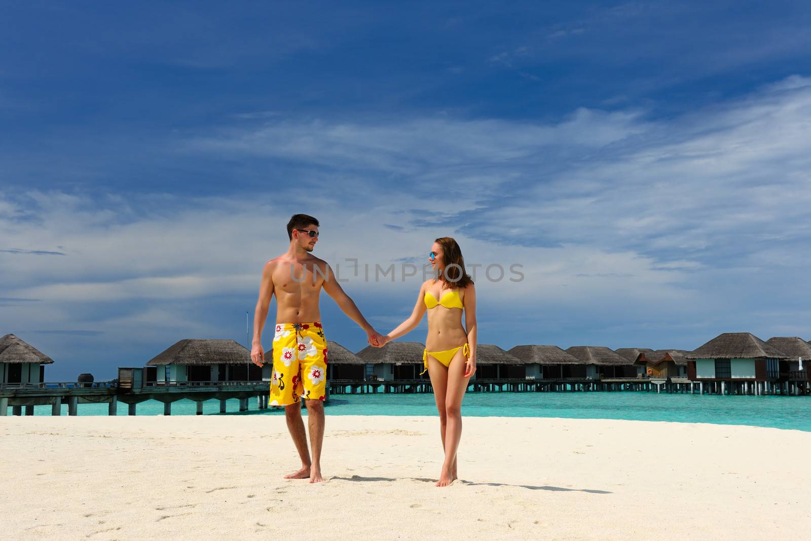 Couple on a tropical beach at Maldives