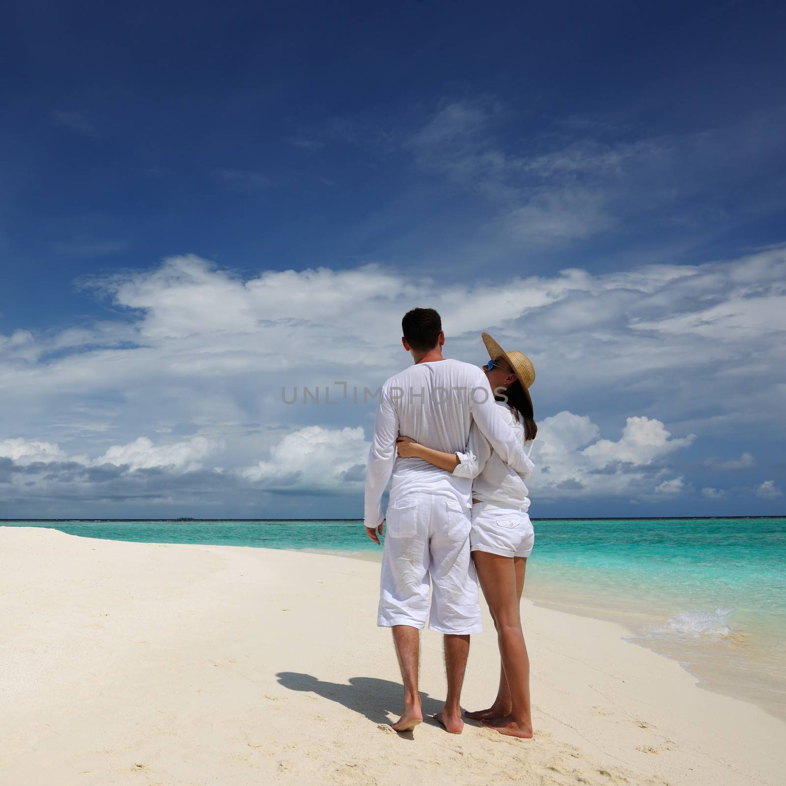 Couple on a tropical beach at Maldives