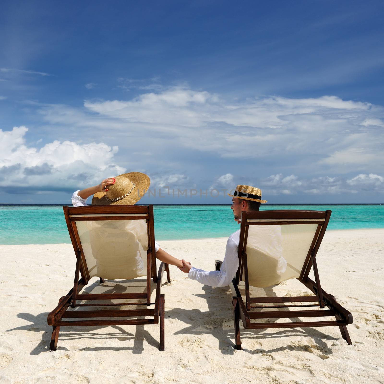 Couple on a tropical beach at Maldives