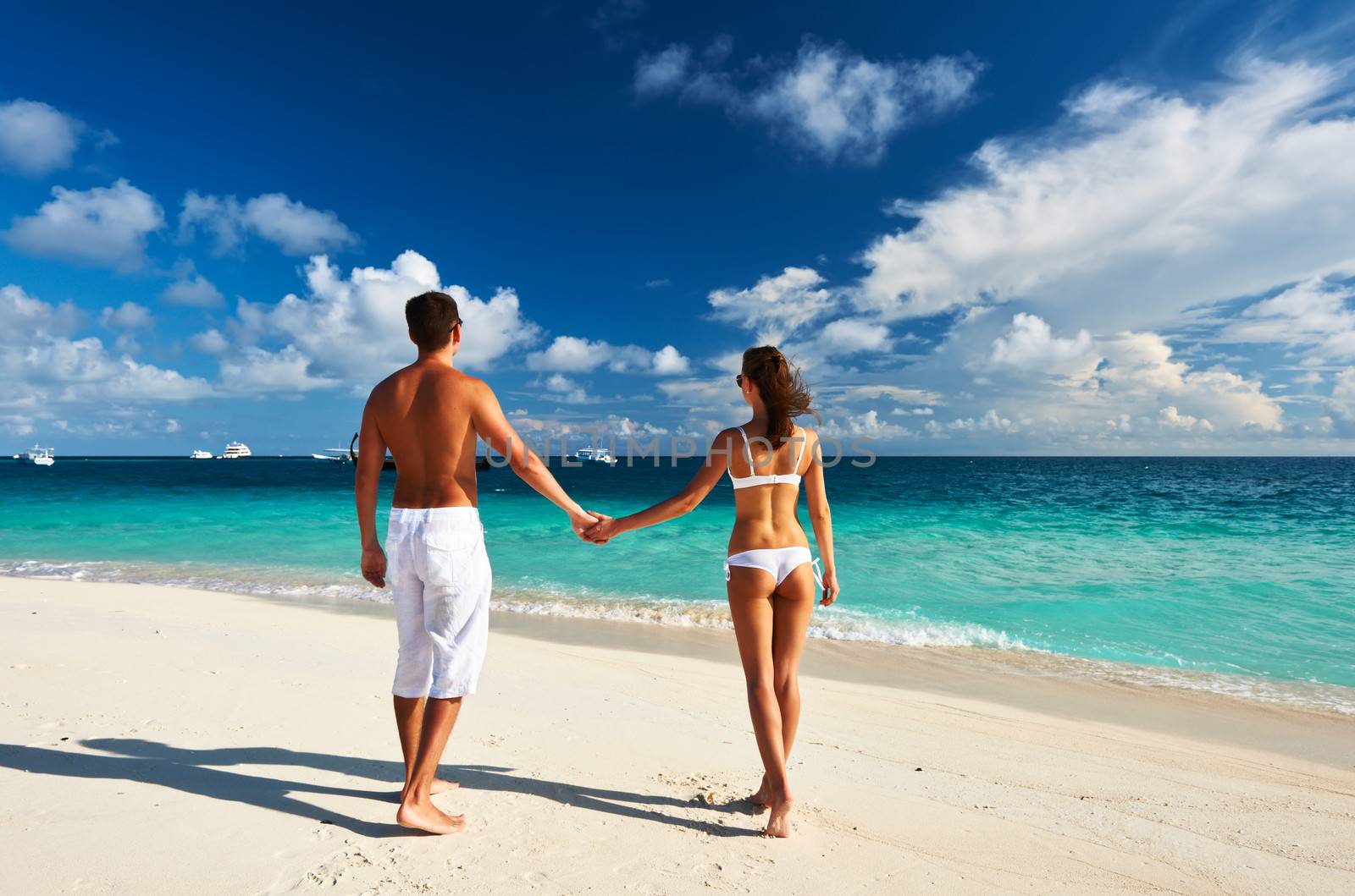 Couple on a tropical beach at Maldives