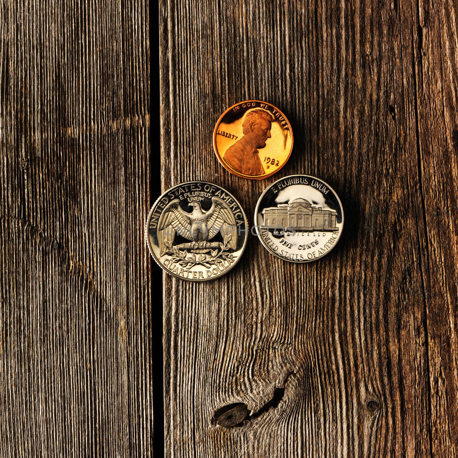 US cent coins over wooden background by haveseen