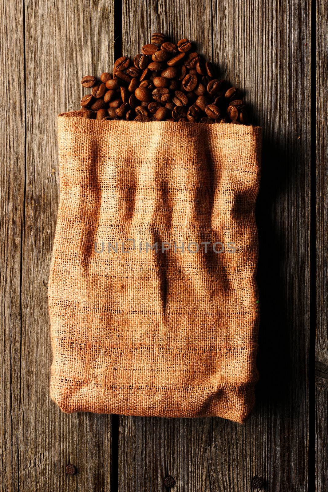 Coffee beans in bag background by haveseen
