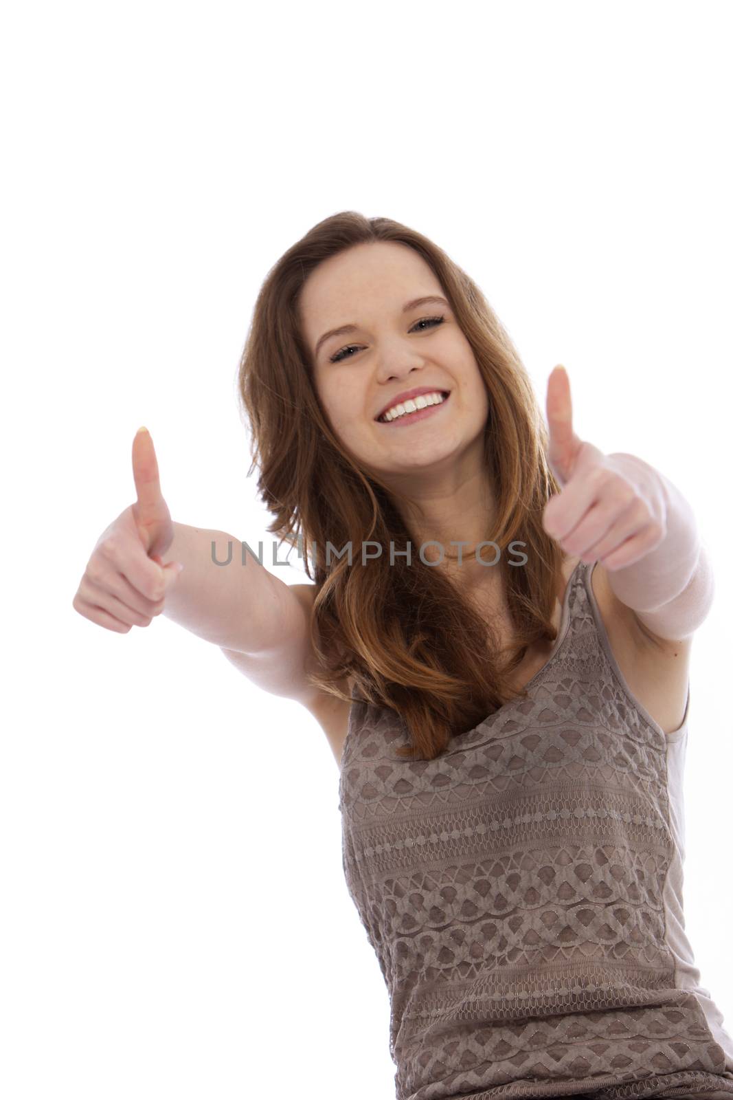 Vivacious teenager giving a thums up gesture with both hands to signify her approval, success and optimism isolated on white