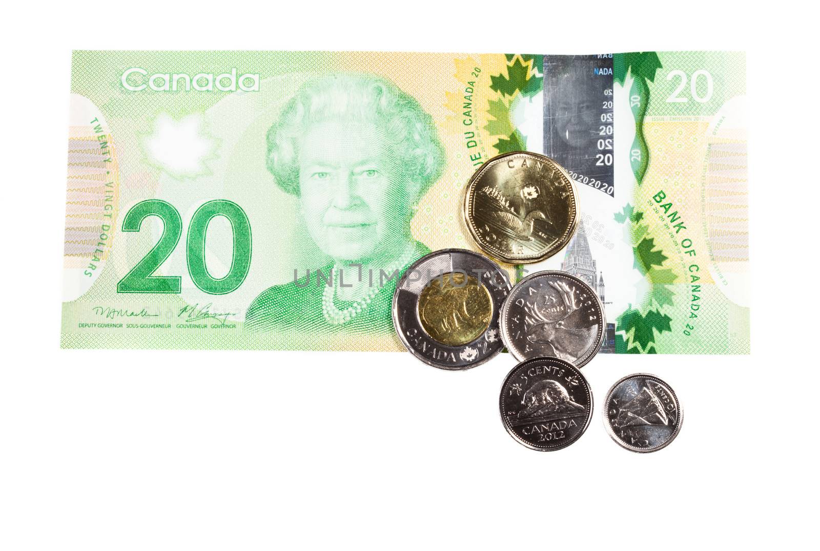 All the actual Canadian Money from coins to twenty-dollar bill Isolated on White