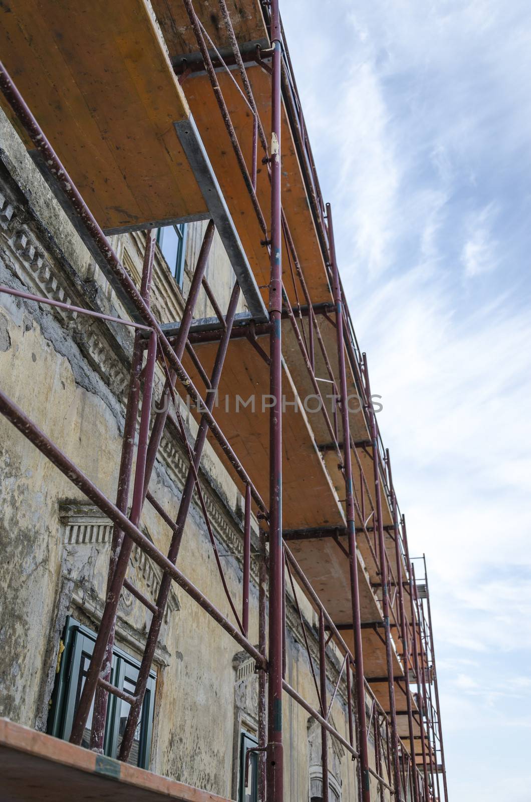 Scaffold surrounding old house during renovation works.