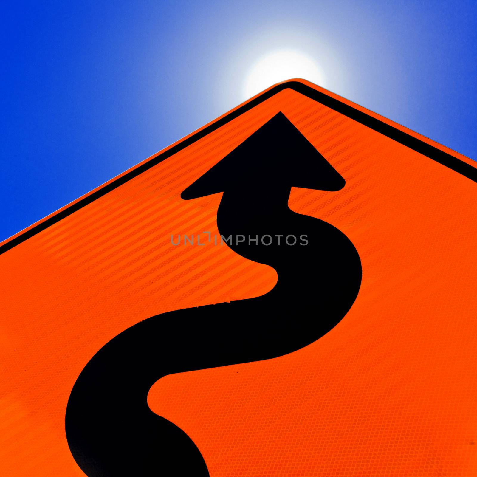 Wavy arrow on road sign pointing up for success by PiLens