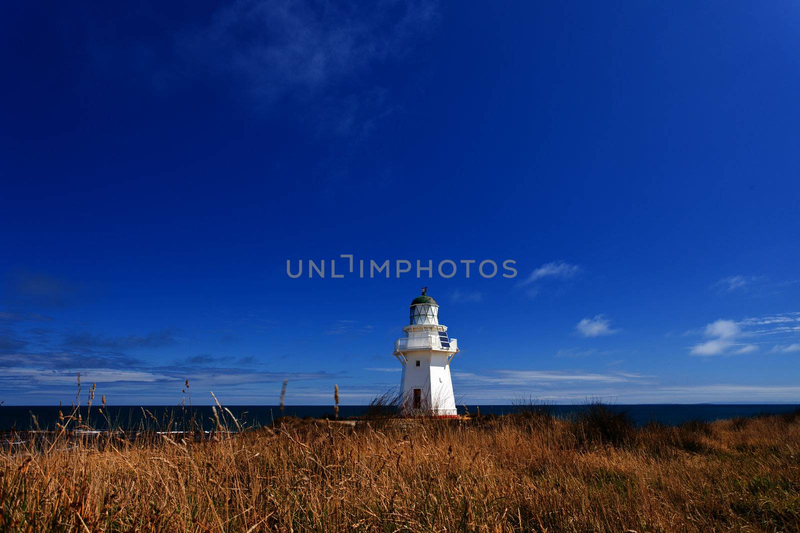 Beautifully restored heritage building of Waipapa Point Lighthouse on The Catlins coast on South Island of New Zealand