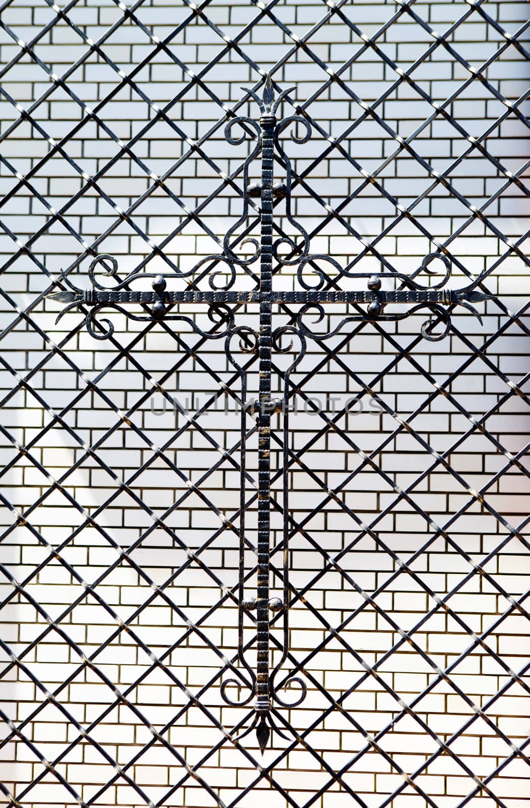 metal cross on the fencing