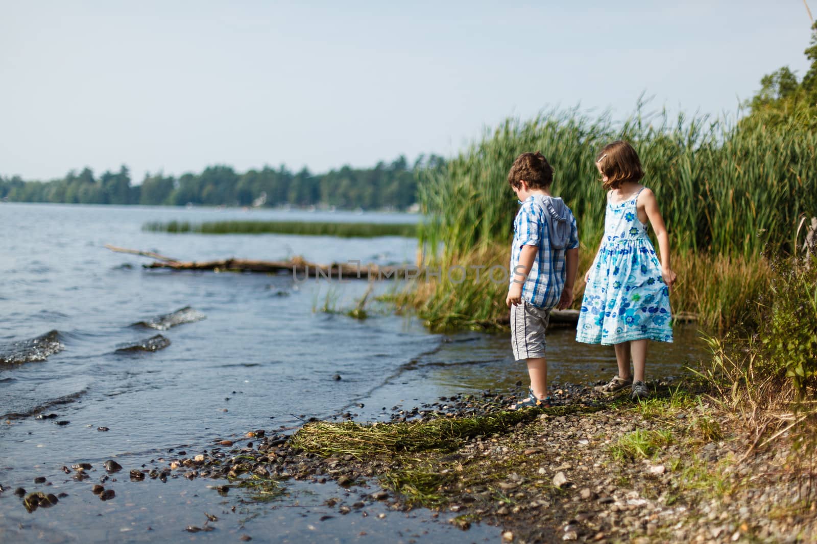 Brother and sister by a lake by Talanis