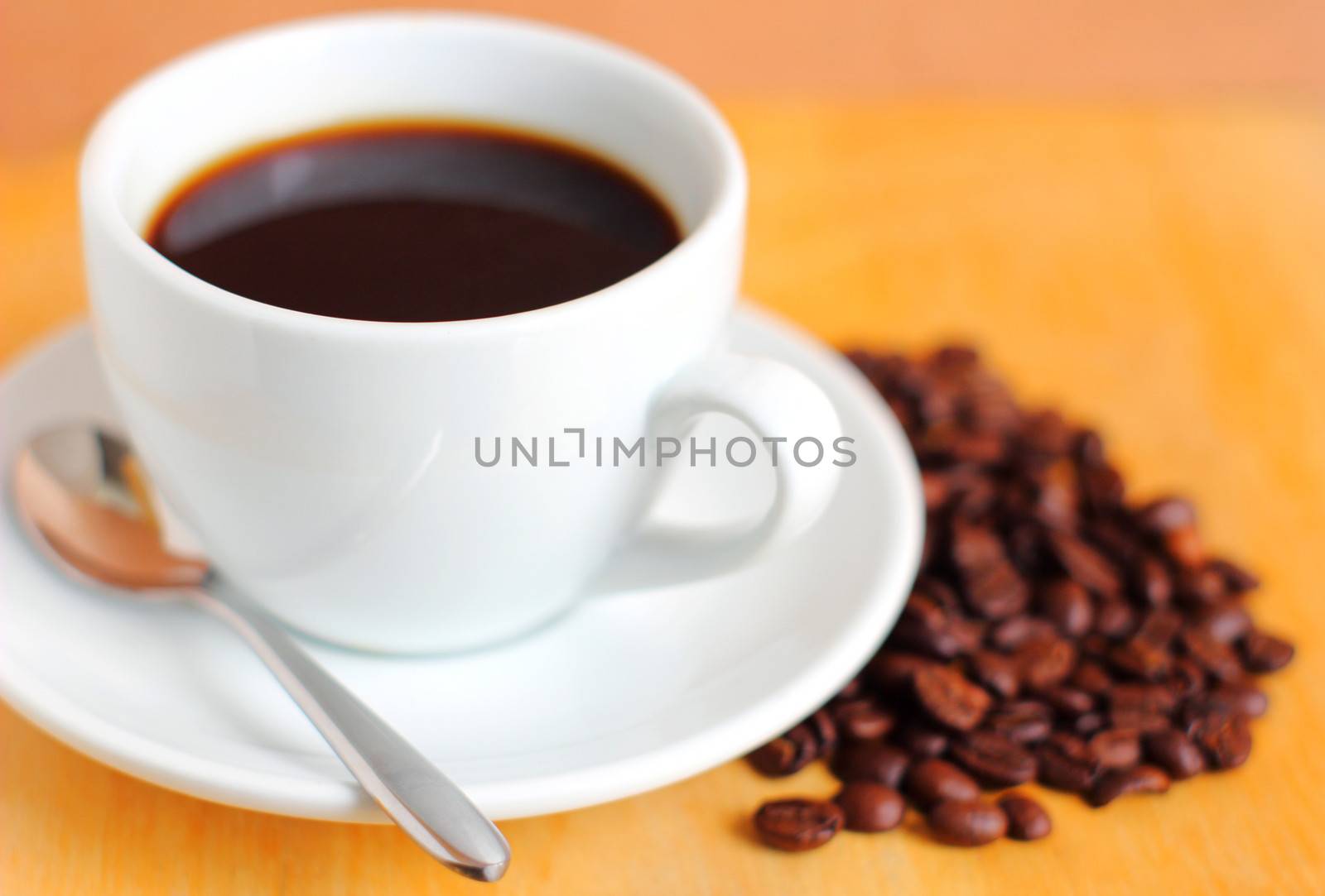 White cup of coffee with coffee beans by nuchylee