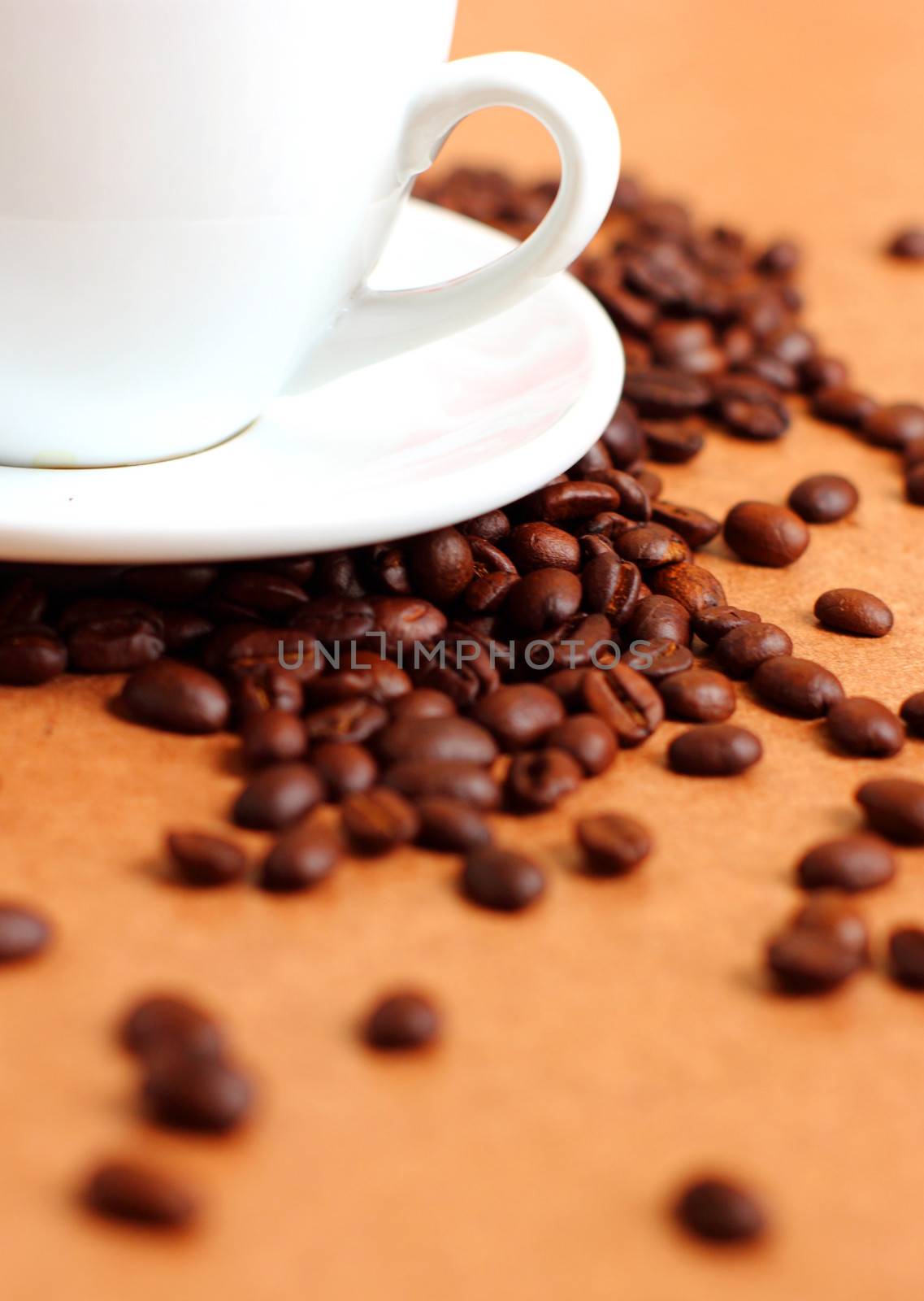 Part of white cup coffee with coffee beans