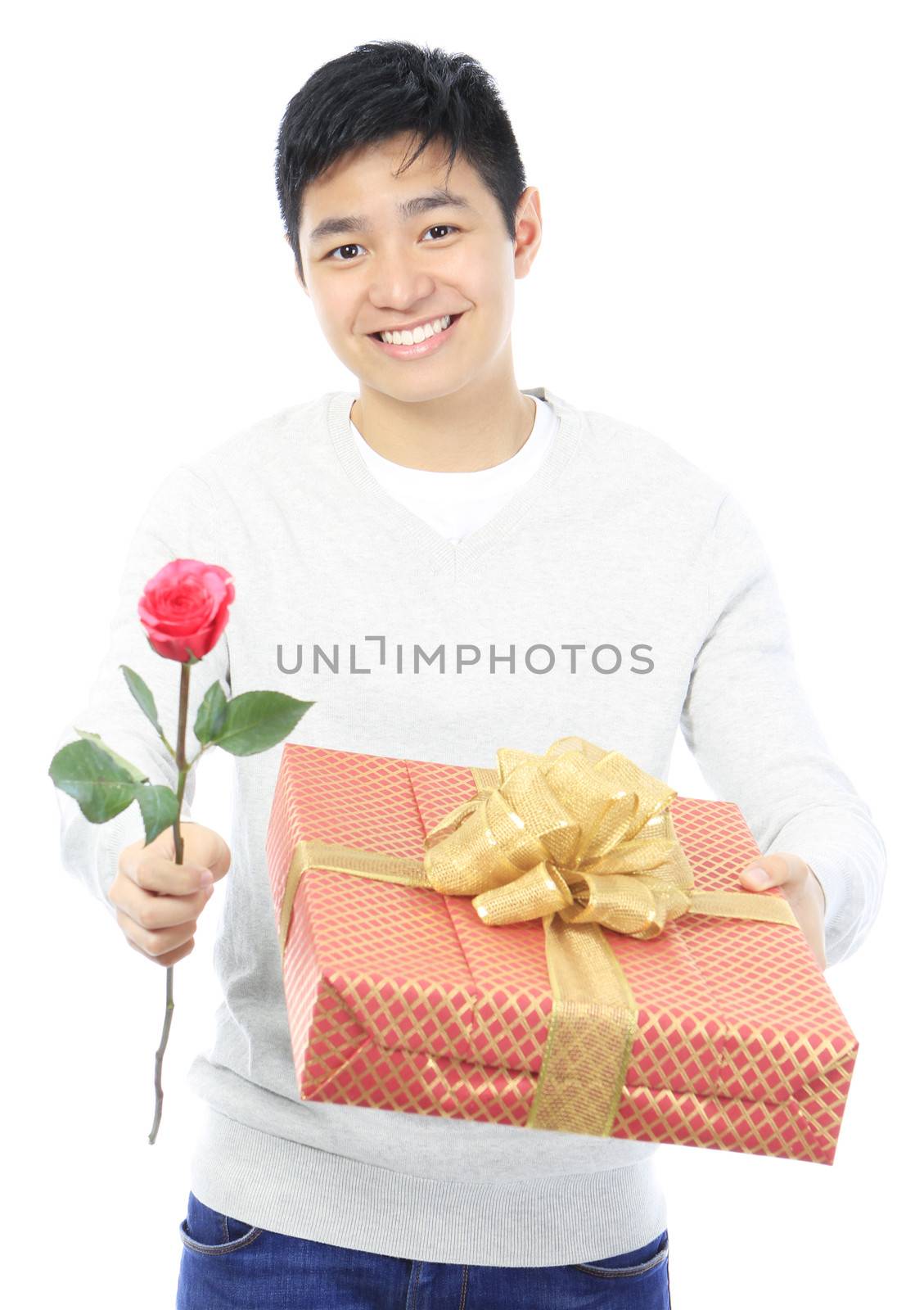 A teenager offering a flower and a gift