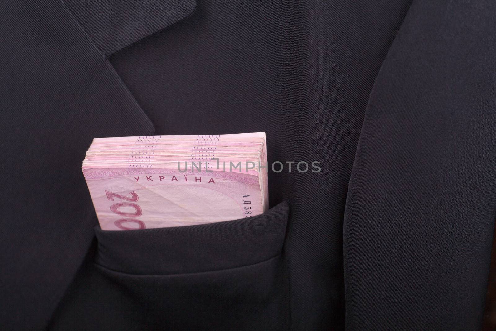 Ukrainian money's worth 200 hryvnia in the pocket of black jacket