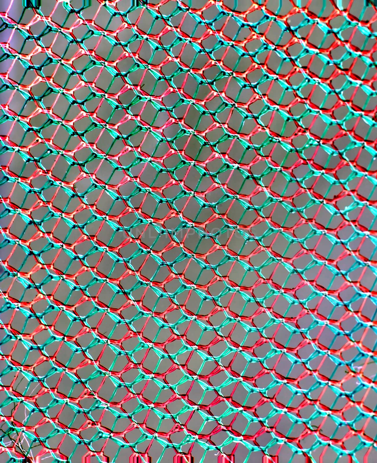 abstraction in the form of a multicolored grid of cells on a gray background