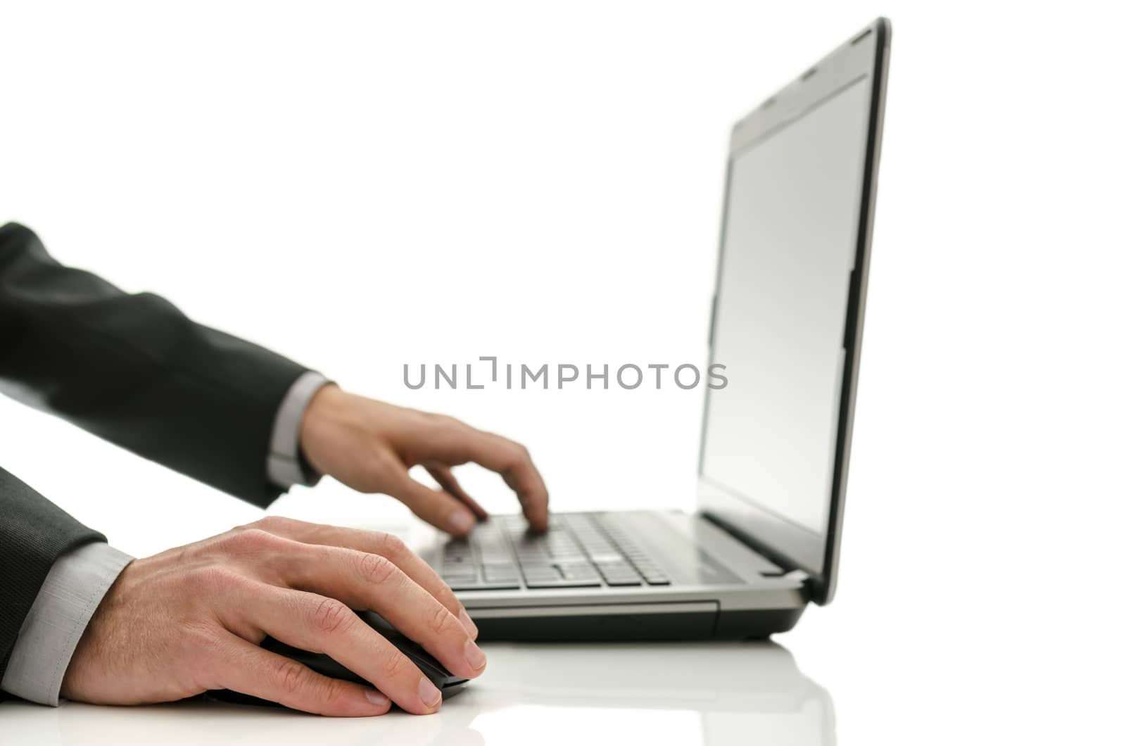 Closeup of businessman using laptop. Isolated over white background.
