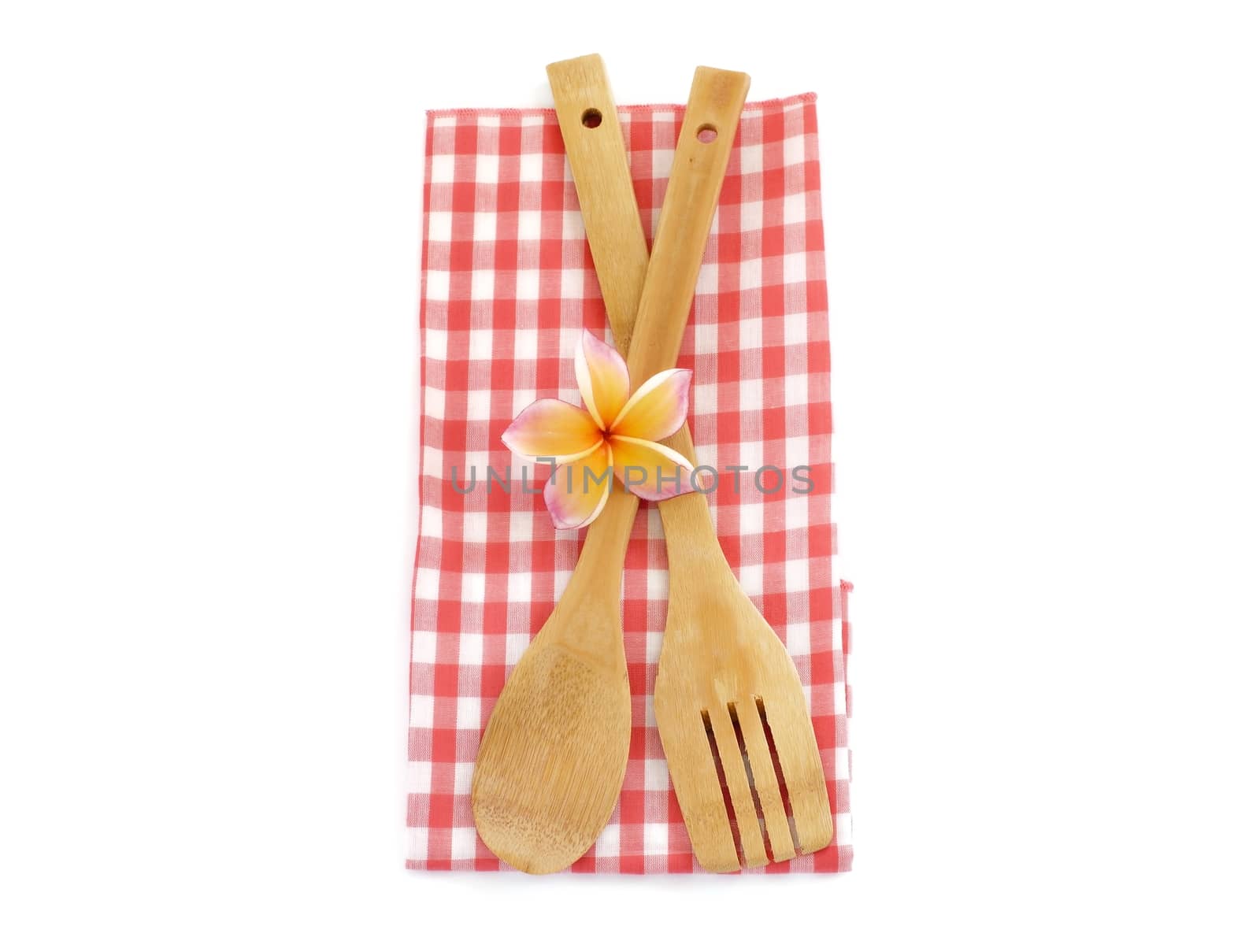Wooden cooking utensils with flower isolated on white background