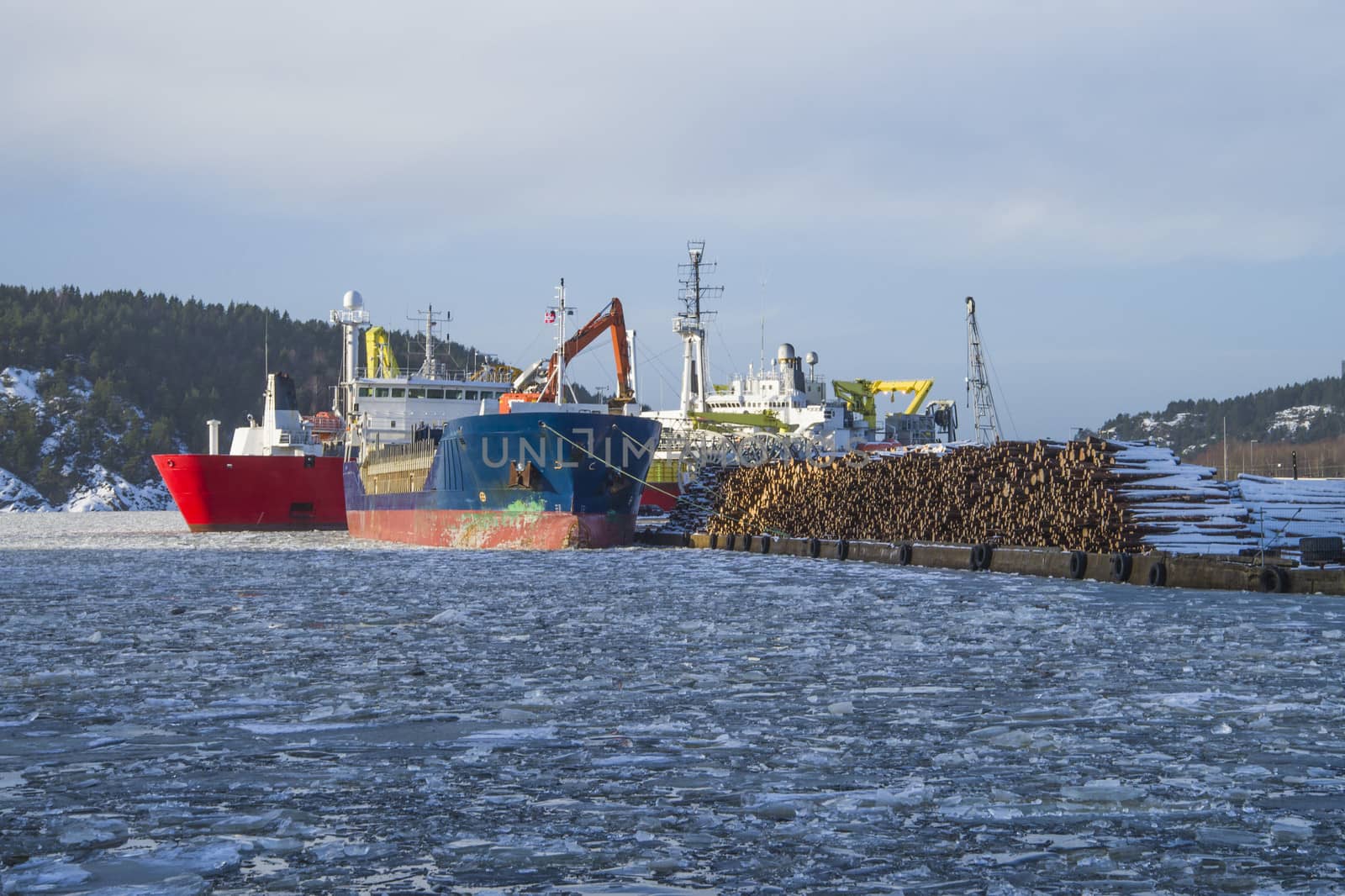 Mv Hagland Boss, are docked at the port of Halden, Norway and unloading timber.