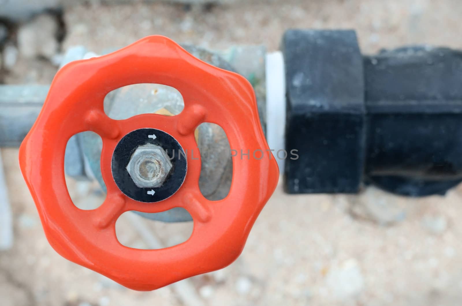 orange water valve and steel pipe