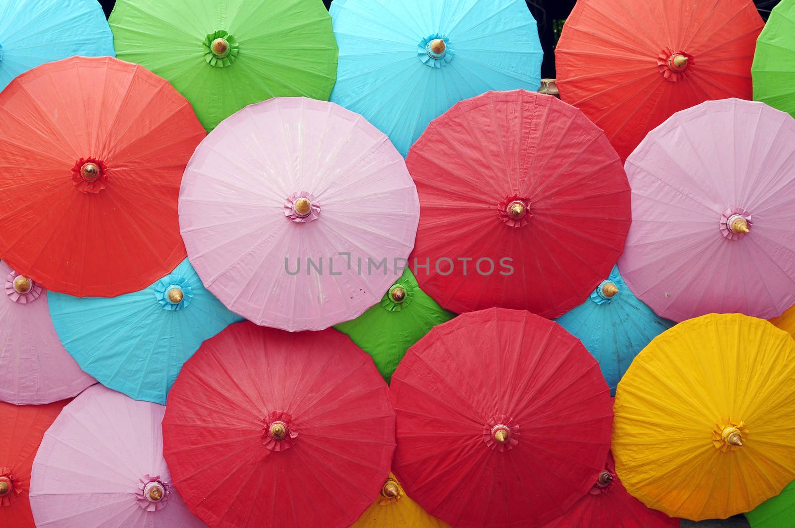 Colorful umbrellas in a pile