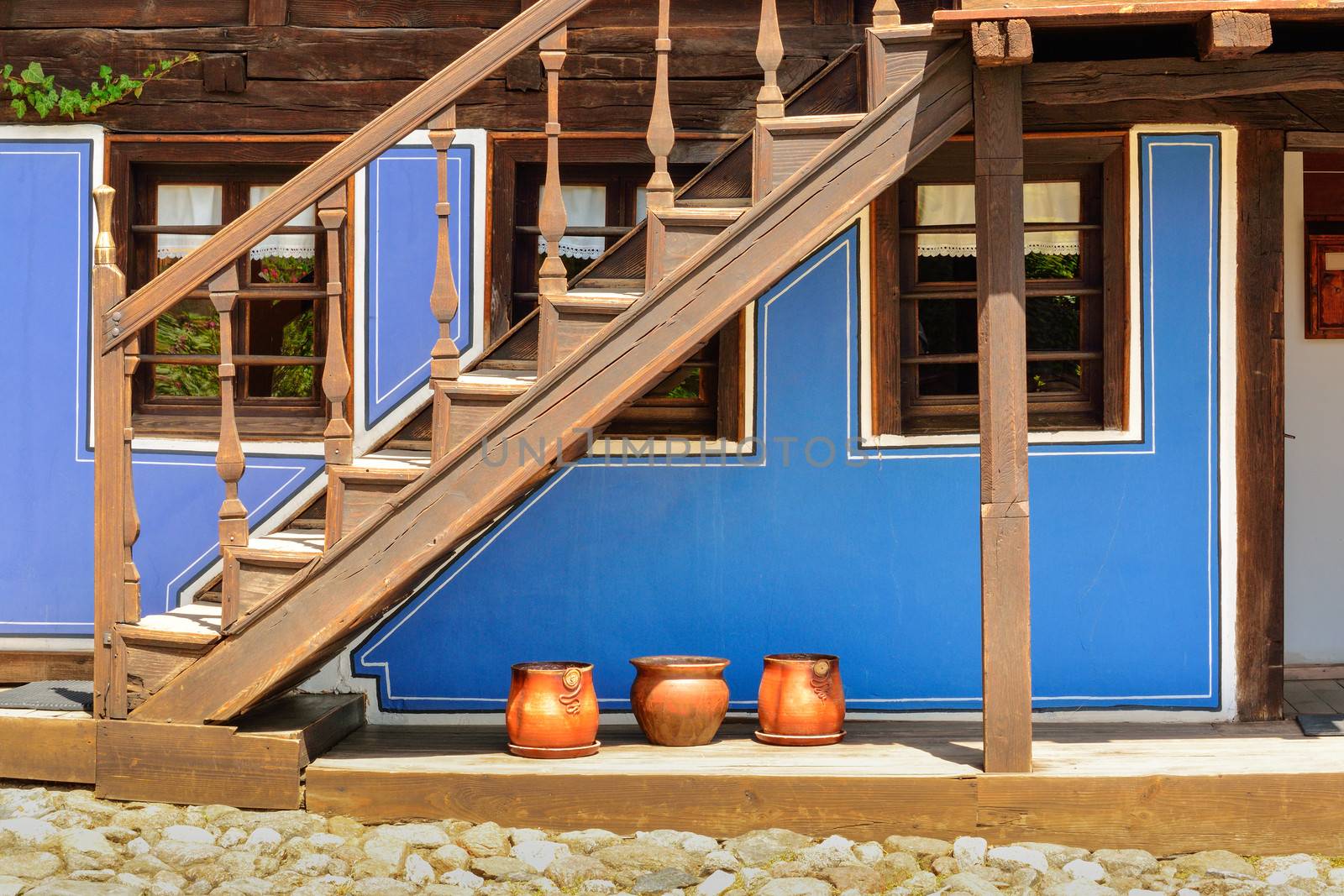 Wooden stairs and an old house in Koprivshtitsa Bulgaria, from t by velislava