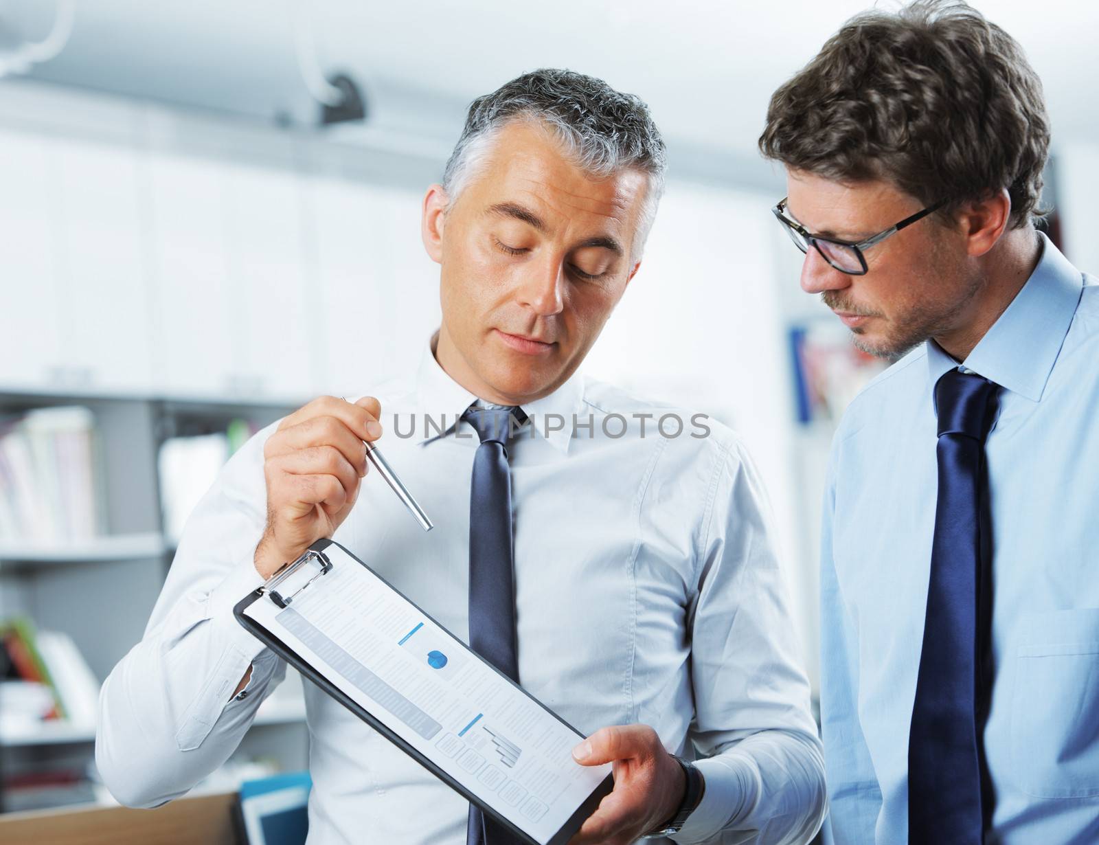 Business men discussing together in an office