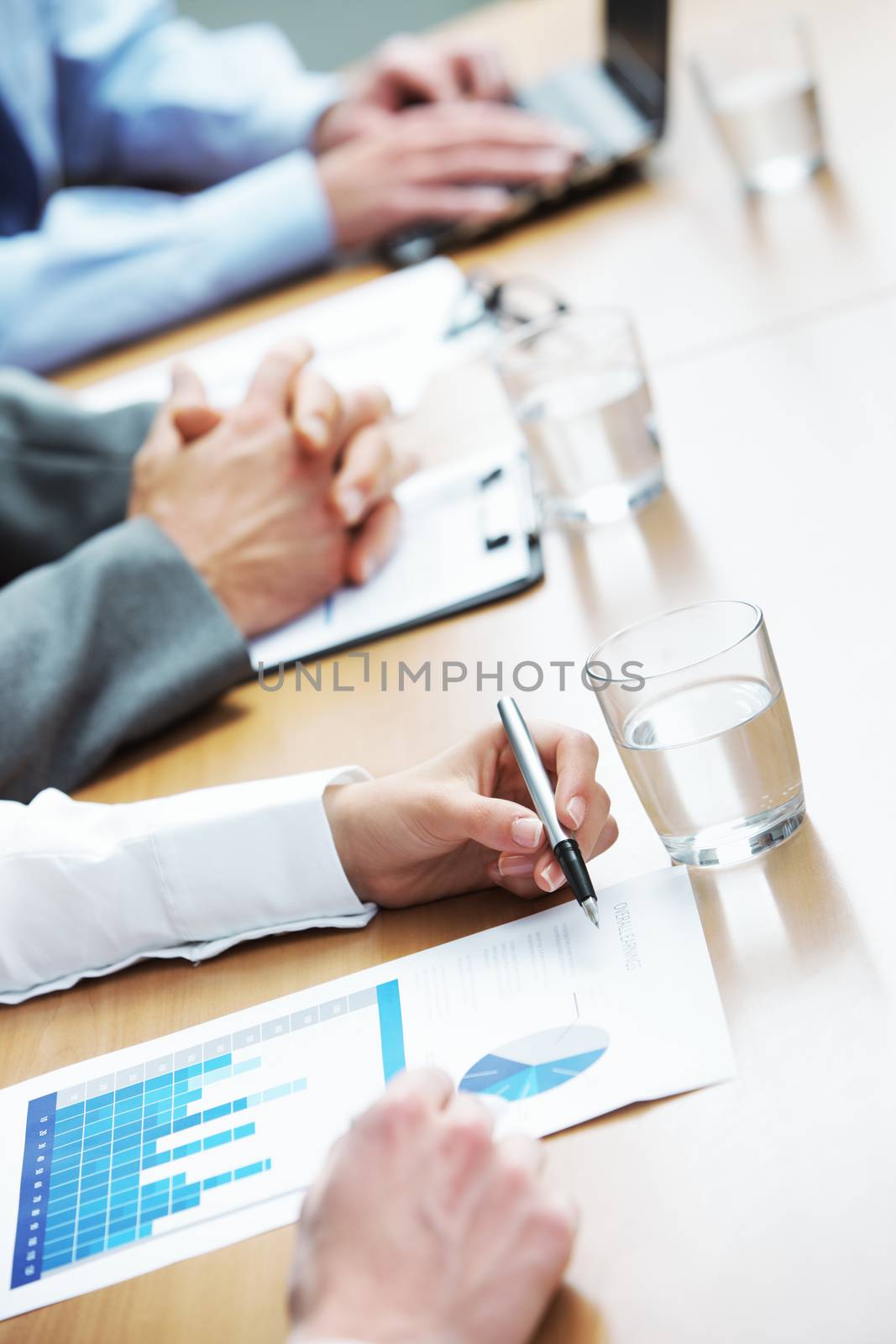 Close up of hands of business people during a meeting