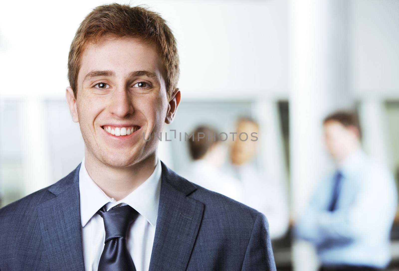 Young business man portrait by stokkete