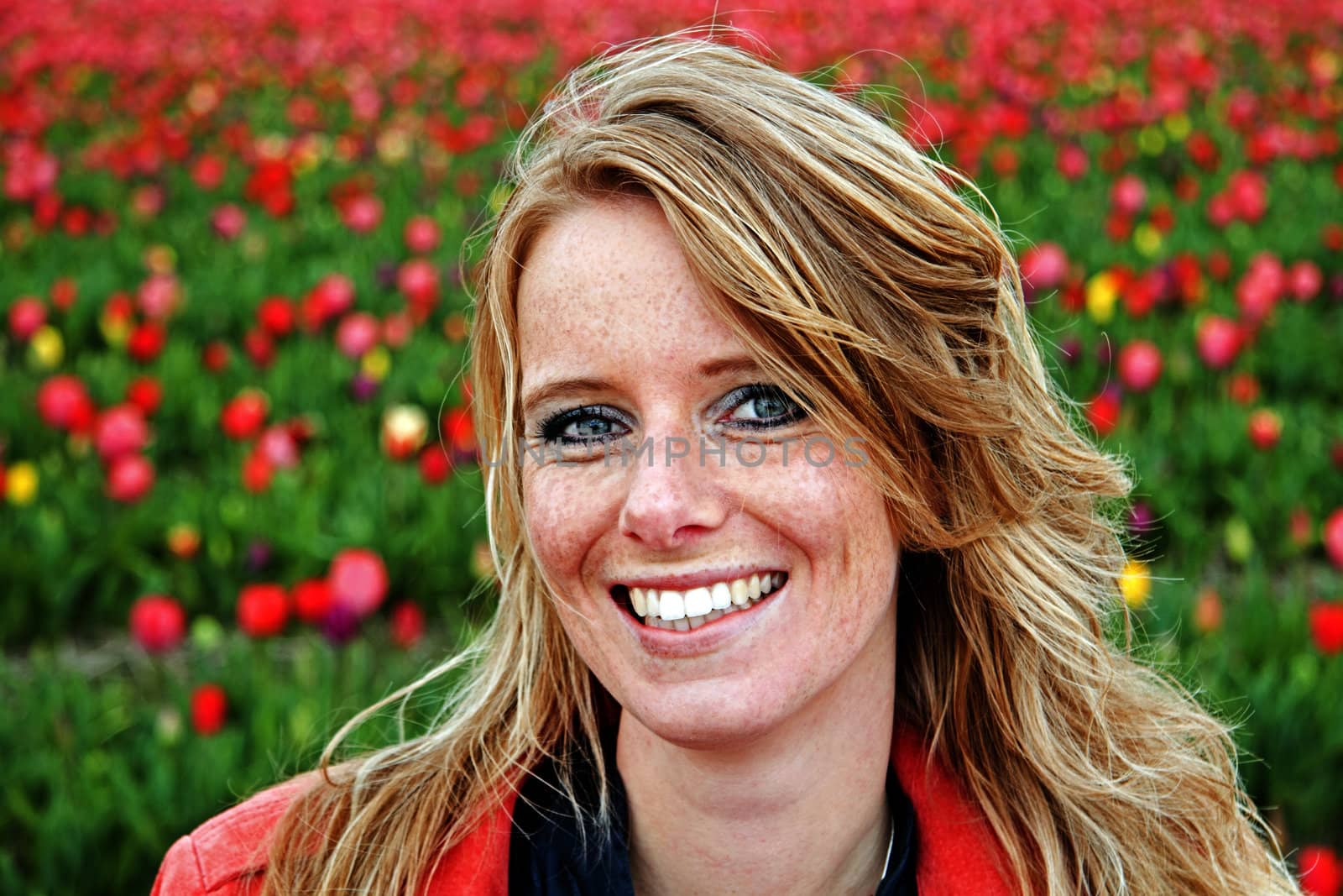 Young woman in the tulip fields