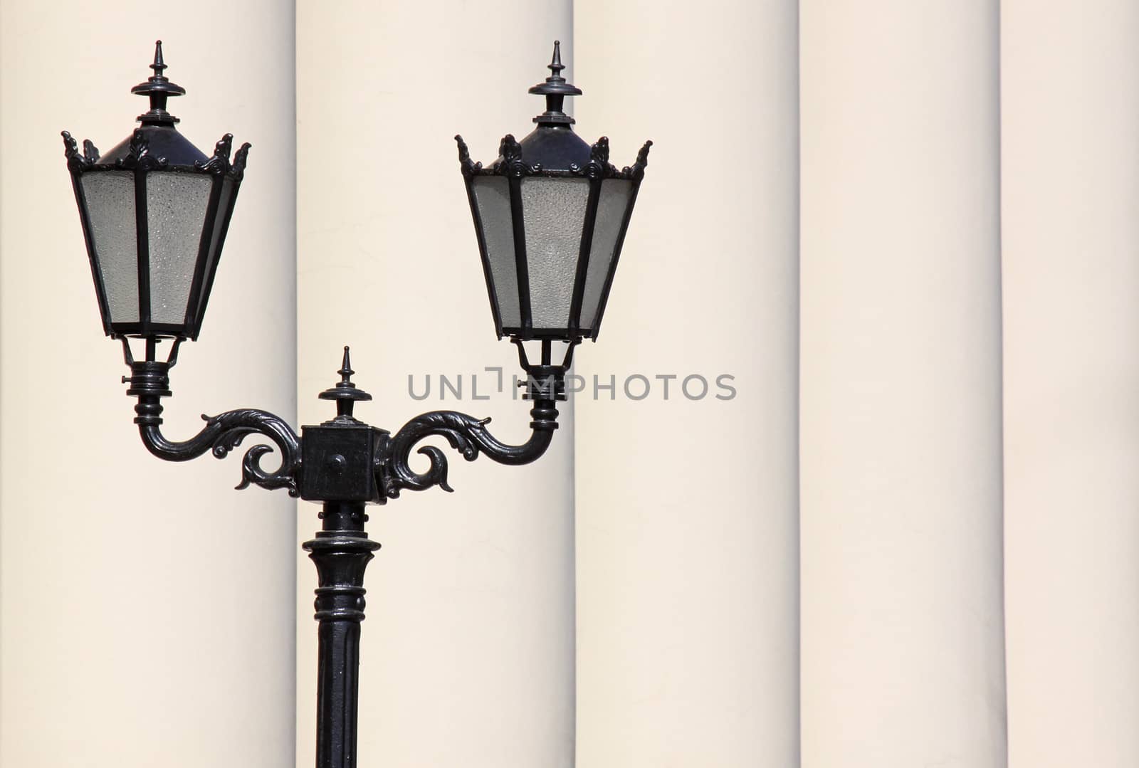 street lantern in front of row of pillars