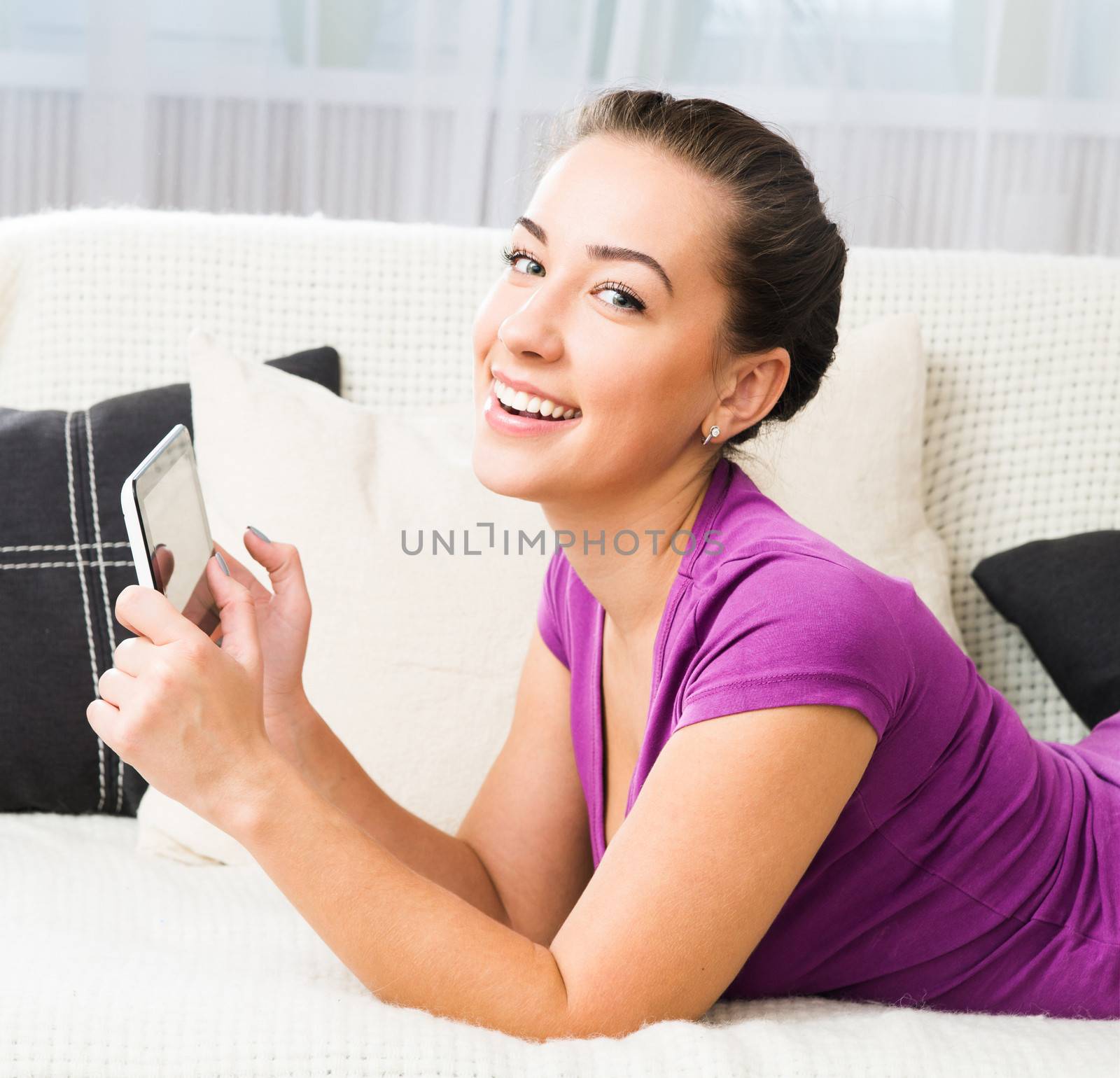 Smiling Brunette girl with tablet pc