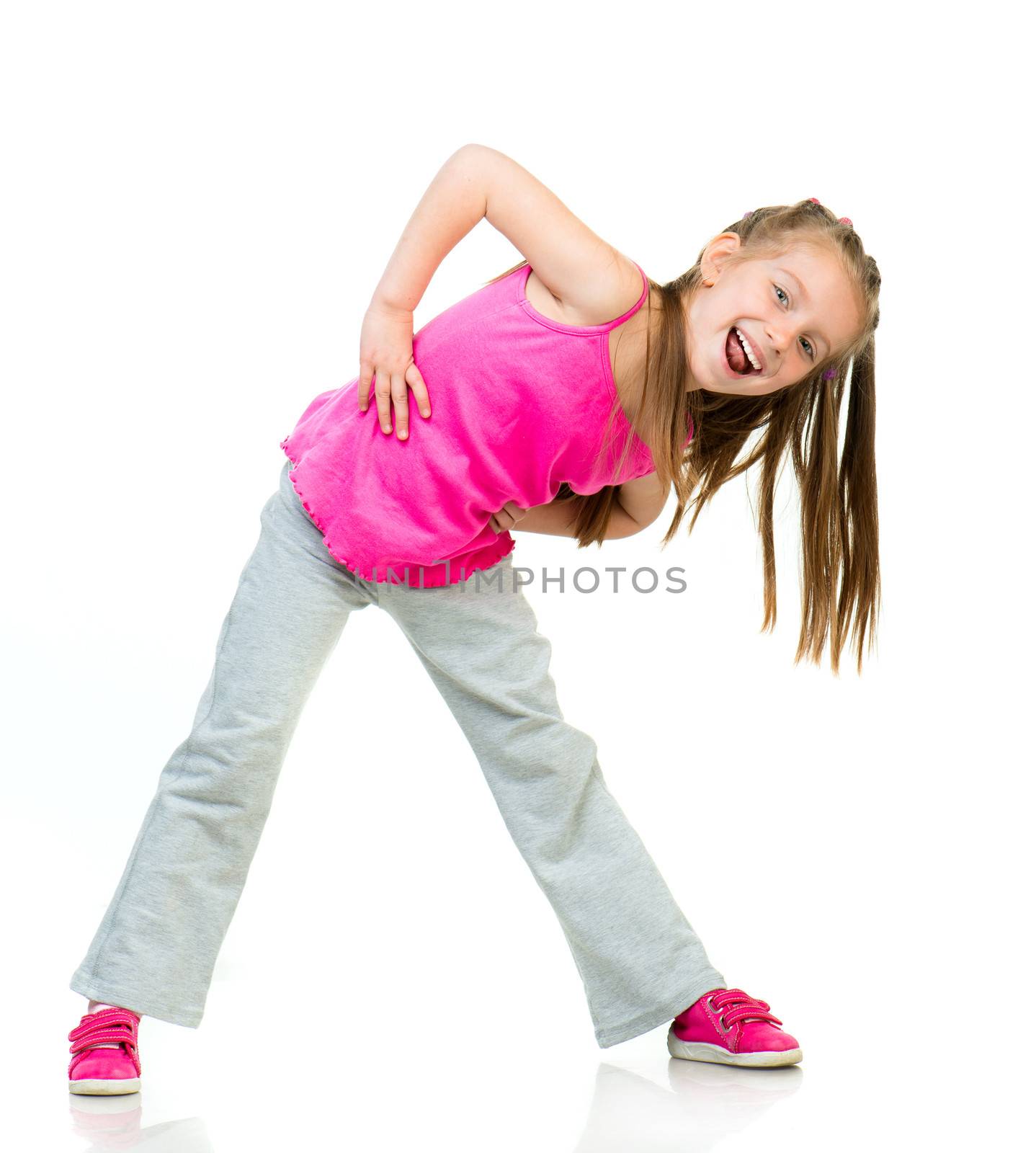 young girl gymnast isolated on a white background