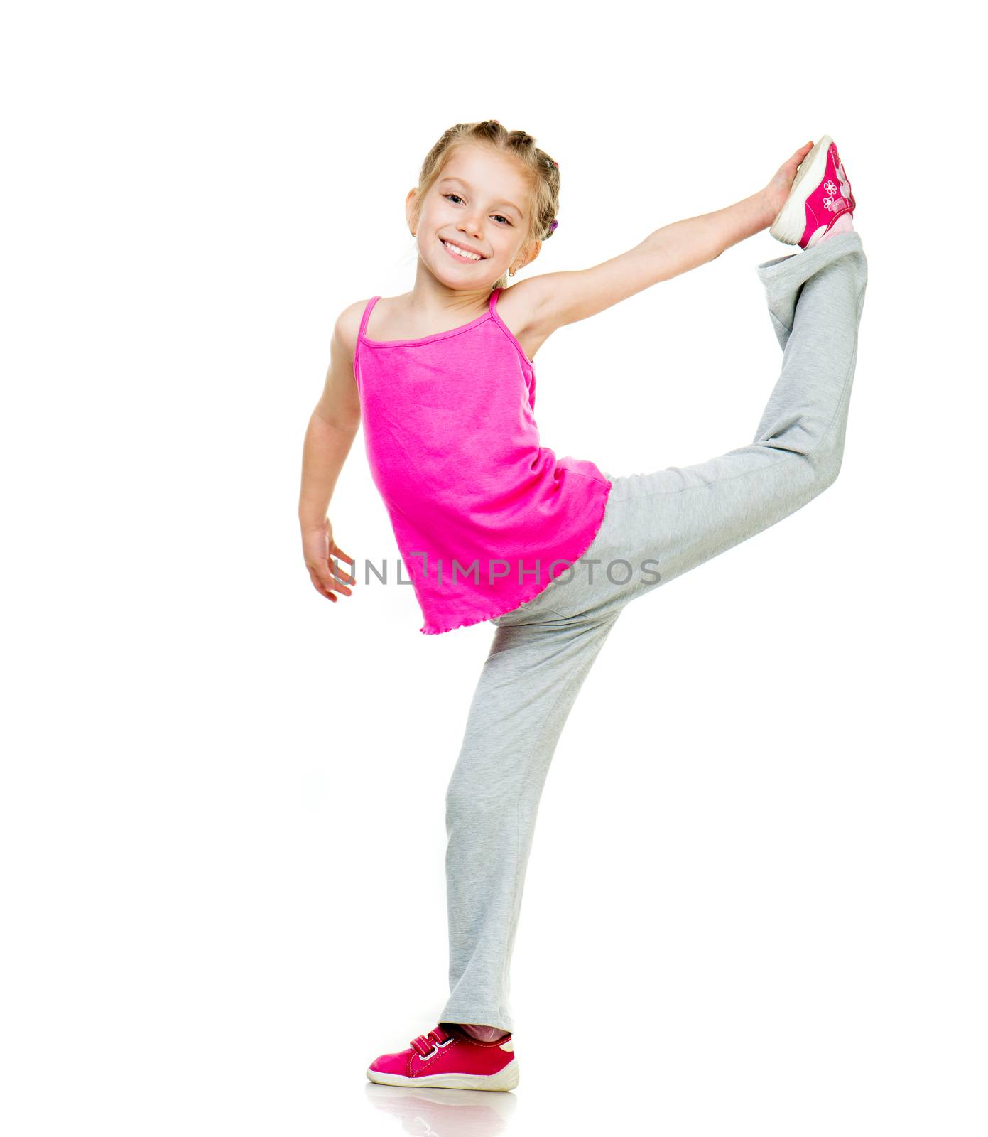 Little girl doing gymnastics over white background